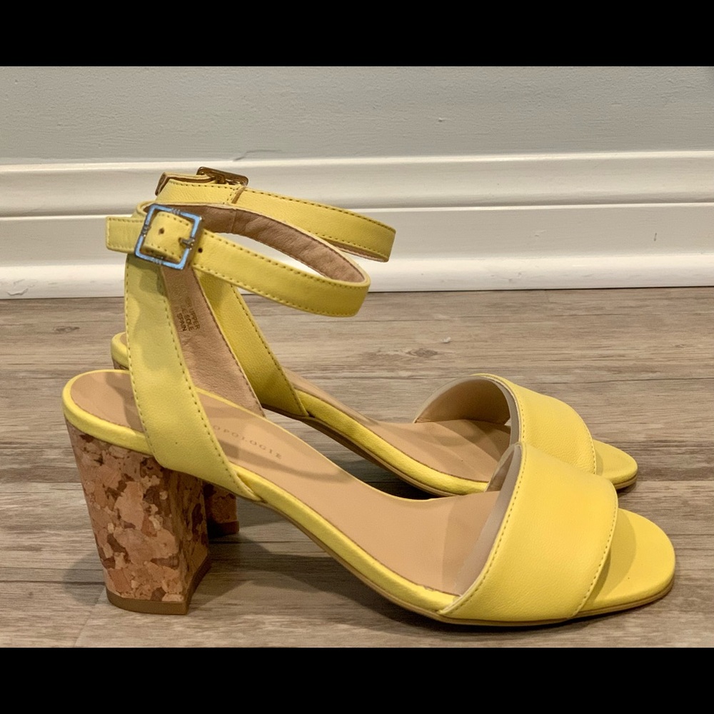Canary colored Anthropologie leather with cork heal strapped sandals